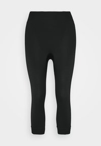 Schwarze Sportleggins mit strukturiertem Punkte-Muster an den Seiten, enganliegendem Design und breitem Bund. Hergestellt aus dehnbarem, atmungsaktivem Stoff.