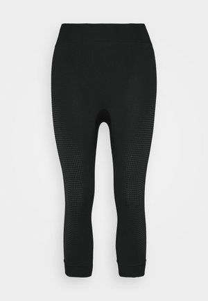 Zwarte sportleggings met een textuur van stippen aan de zijkanten, aansluitend ontwerp en een brede tailleband. Gemaakt van rekbaar, ademend materiaal.