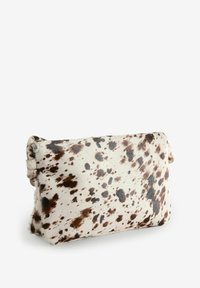 Cowhide clutch bag featuring a white base with irregular brown and black spots, soft texture, and a simple, structured shape.