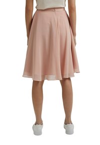 Ljusrosa A-linjeformad kjol i flödande tyg, med midjelång design, dold dragkedja bak och slät yta.