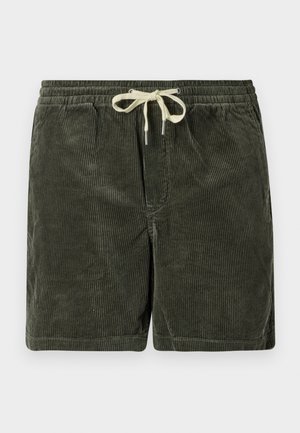 Dunkelgrüne Cordshorts mit einem Gummizugbund. Verfügt über eine vertikale Rippstruktur und metallene Enden der Zugband. 