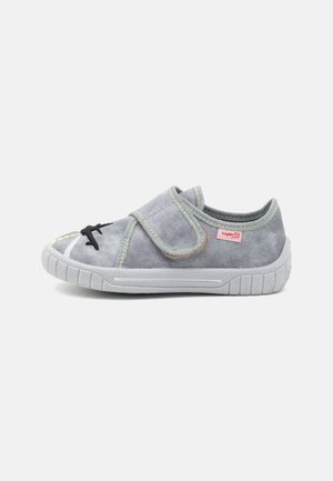 Gray fabric shoe with a Velcro strap, white rubber sole, green stitching accents, and a decorative black shoelace pattern.