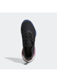 Black athletic shoe with textured upper, featuring a colorful sole transitioning from pink to blue. Laces and branding detail on the tongue.