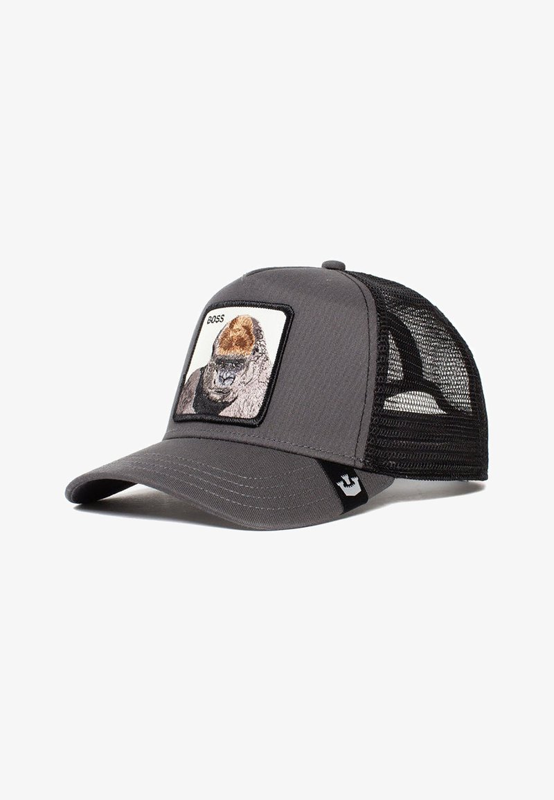 Gorra gris con una parte trasera de malla, con un parche cuadrado de la cara de un gorila y el texto "BOSS" encima. Visera curva y detalles en negro.