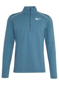 Pullover lungo a maniche lunghe in teal con colletto a mezza zip, caratterizzato da una finitura in tessuto liscia e dettagli riflettenti bianchi vicino alle spalle.