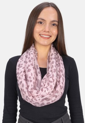 Light pink infinity scarf made of soft fabric with a leopard print pattern in darker pink shades; draped loosely around the neck.