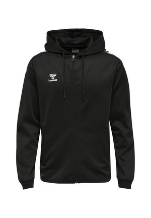 Schwarzer Kapuzenpullover mit Reißverschluss und Kordelzug, weißes hummel-Logo auf der Brust und Chevron-Streifen auf den Schultern. Lange Ärmel mit gerippten Bündchen.