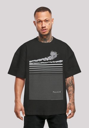 Black oversized t-shirt featuring horizontal white stripes, a graphic design of a cloud and a green object, and text along the bottom.
