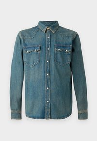 Jeanshemd in mittlerem Blau mit klassischem Kragen, langen Ärmeln, zwei vorderen Taschen und zentralem Knopfverschluss; verfügt über dezente Nähtdetails.