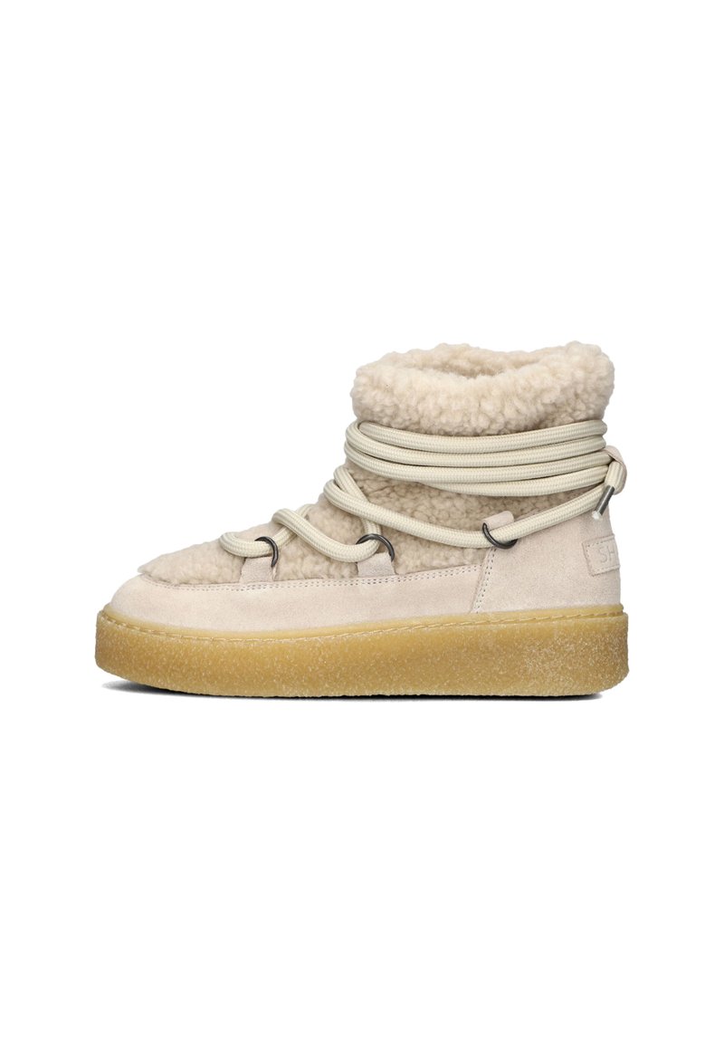 Beige hoge sneakers met een zachte, gestructureerde bovenkant, elastische veters en een gumrubberen zool. Voorzien van een faux schapenvacht kraag.