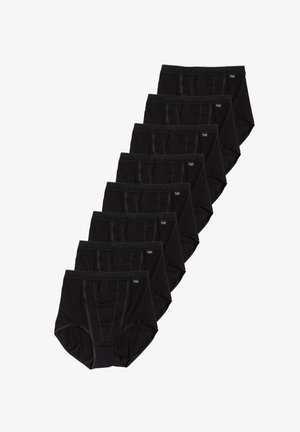 Sette paia di slip neri a vita alta disposti in fila diagonale su sfondo bianco.