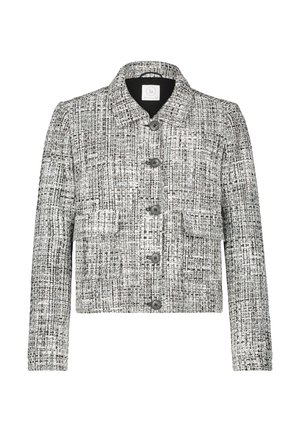 Gelaagde zwart-witte cropped jas met een kraag, knopen aan de voorkant en twee voorzakken. Geschikt voor lagen.