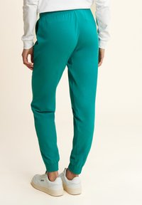 Freddy CON ELASTICO SUL E DETTAGLI FLOREALI - Pantalones deportivos - greenlake