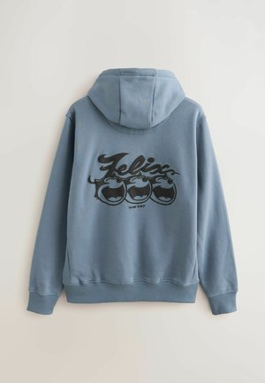 Modra kapuca iz mehkega materiala z velikim črnim risanim grafičnim motivom Felix the Cat na hrbtni strani. Vključuje kapuco z vrvico in rebraste manšete.