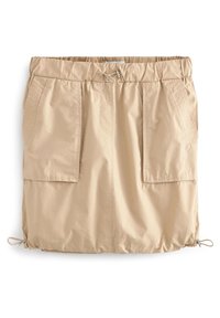 Jupe-short beige en tissu léger, dotée d'une ceinture élastique, de deux poches avant et de cordons de serrage à l'ourlet.