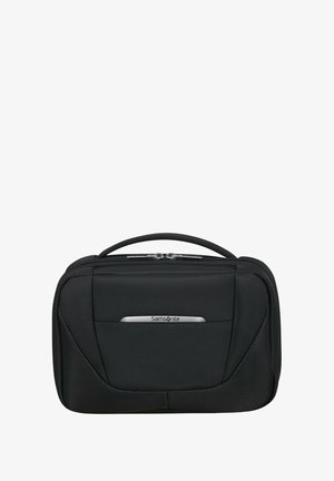 Schwarze Samsonite Reisetasche mit glattem Stoffmaterial, doppelten Reißverschlüssen, einem Handgriff an der Oberseite und einem silbernen Logo-Akzent auf der Vorderseite.