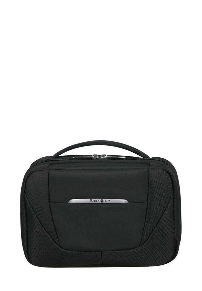 Sac de voyage noir Samsonite avec une texture de tissu lisse, deux zips, une poignée supérieure et un accent logo argenté sur le panneau avant.