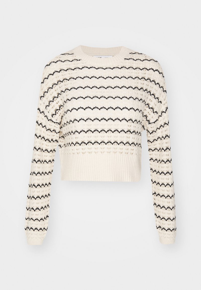 Pull cropped en crochet crème avec un motif zigzag noir, manches longues et ourlet côtelé. Fabriqué en tissu tricoté texturé.