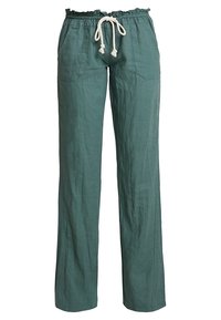 Pantalons en lin vert à coupe décontractée, avec une taille élastique et un cordon de serrage. Comprend des poches latérales et une surface lisse et texturée.