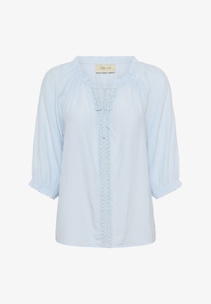 Light blue blouse with a round neckline, adjustable tie, and embroidered vertical embellishment down the center; features balloon sleeves.