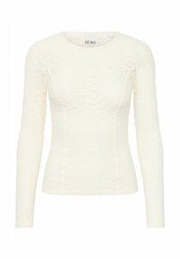 Haut ajusté à manches longues en dentelle crème avec un motif texturé. Présente un col rond et des détails de couture. Étiquette de marque visible à l'intérieur.