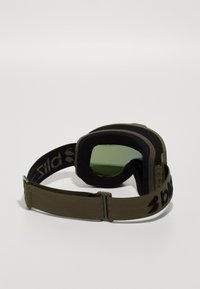 Skibriller i olivengrøn med en blød, polstret ramme, mørkt glas og justerbart rem med et logo. Velegnet til vintersport.