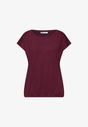 Camiseta de manga corta para mujer en burdeos oscuro con escote redondo y dobladillo elástico, mostrada extendida sobre fondo blanco.