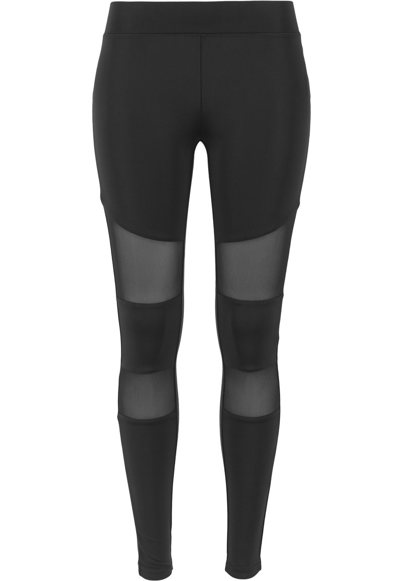 Leggings neri con pannelli in mesh trasparenti sulle ginocchia, texture liscia e design aderente per un aspetto atletico contemporaneo.