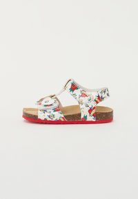 White sandals with colorful floral and heart patterns, two adjustable straps, and a red rubber sole. Cork-like footbed for comfort.