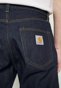 Carhartt WIP PONTIAC PANT MAITLAND - Tiesaus kirpimo džinsai - blue one wash