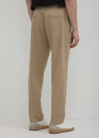 Calliope JOGGER - Stoffhose - beige