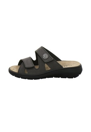 Black open-toe slide sandal with two adjustable straps and decorative metal button on thick sole, side view on white background.