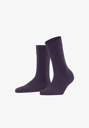 Dark purple socks with a smooth texture, mid-calf length, and ribbed cuff. Subtle logo detail on the side.