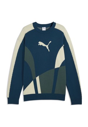 Blauwe en crèmekleurige trui met lange mouwen, abstracte vormen en een wit Puma-logo in het midden van de borst.