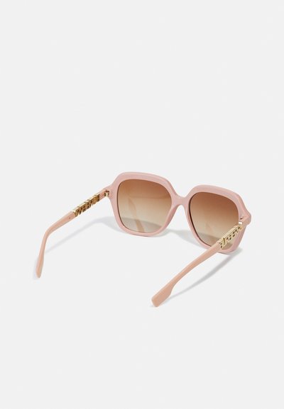 Pink plastic sunglasses with square frames, gradient brown lenses, and gold-tone accents on the temples featuring embossed lettering.