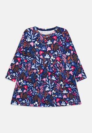 Robe bleu marine à manches longues pour filles avec un motif floral coloré en rose, violet, blanc et orange, encolure ronde et taille froncée.