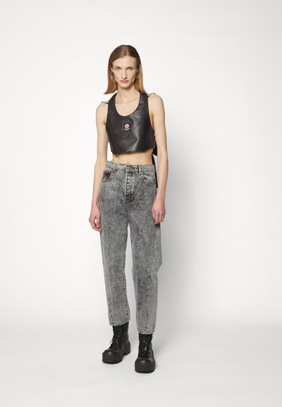 Black cropped top with smooth texture, gray high-waisted jeans, and chunky black platform boots. Simple design with minimal accents.