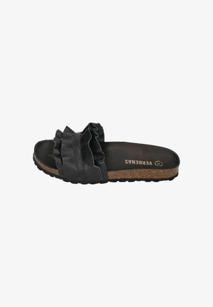 Black slide sandal with ruffled leather strap, cork sole, and textured tread, labeled "VERBENAS" inside.