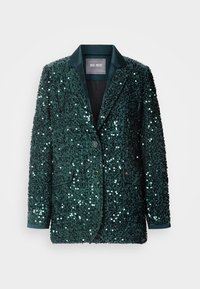 Grønn paljettblazer med en glatt satengrevers, to knapper og sidelommer. Teksturert overflate reflekterer lys, som skaper en glitrende effekt.