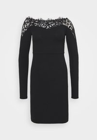 Svart klänning med långa ärmar och avskuren design med spetsdetaljer. Slät textur, figurnära silhuett och längd ovanför knäet.