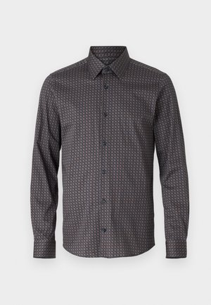 Long-sleeve shirt in dark blue fabric with a subtle geometric pattern in lighter blue and brown. Features a standard collar and button closure.