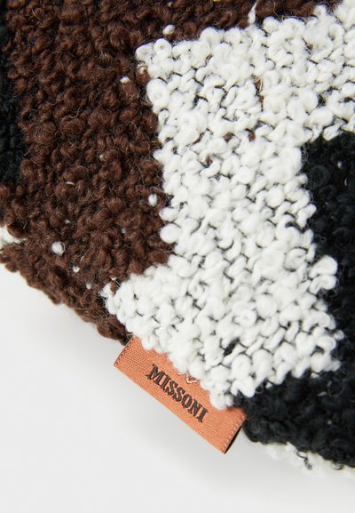 Knit cushion featuring a textured pattern in brown, black, and white fibers; includes a visible Missoni label in a light brown material.