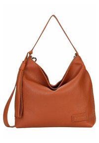 Sac à main en cuir marron avec une bandoulière simple, détail pompon sur le côté et étiquette de marque visible indiquant "SURI FREY" en bas à droite à l’avant.