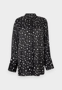 Fekete szatén ing fehér pöttyökkel, hosszú ujjakkal és gallérral. Gombos záródású és bő szabású.