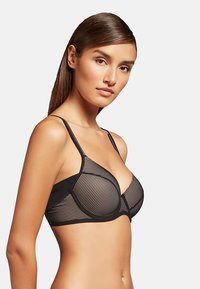 Black bra featuring vertical striped lace design, underwire support, adjustable straps, and a smooth textured band.