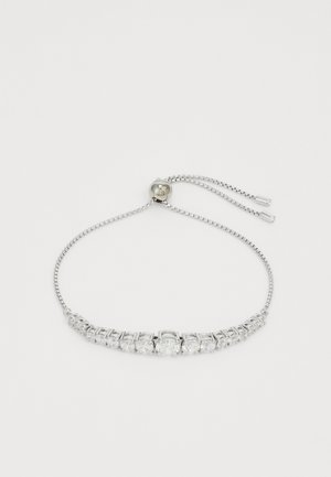 Sidabrinis apyrankė, papuošta aiškiais kubiniais cirkoniais, kurie yra tiek stačiakampių, tiek kvadratinių formų, su reguliuojama grandinėlę ir užsegimu.