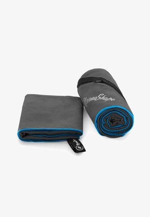 Gray fabric towel, rolled and folded. Features blue piping along edges and a zipper on the roll. Branding text on the surface.