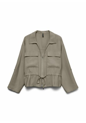 Veste zippée marron clair avec manches larges, deux poches à rabat sur la poitrine et taille ajustable avec cordon.