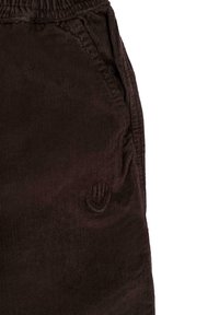 Bruine corduroy broek met een zachte textuur, elastische tailleband en zijzakken met een geborduurd smiley-logo detail.