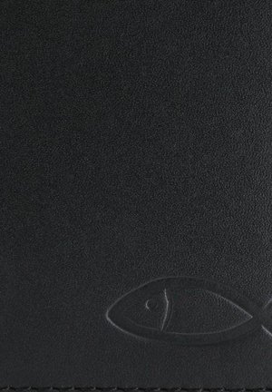 Symbole chrétien du poisson en relief sur une surface noire texturée, positionné près du coin inférieur droit.